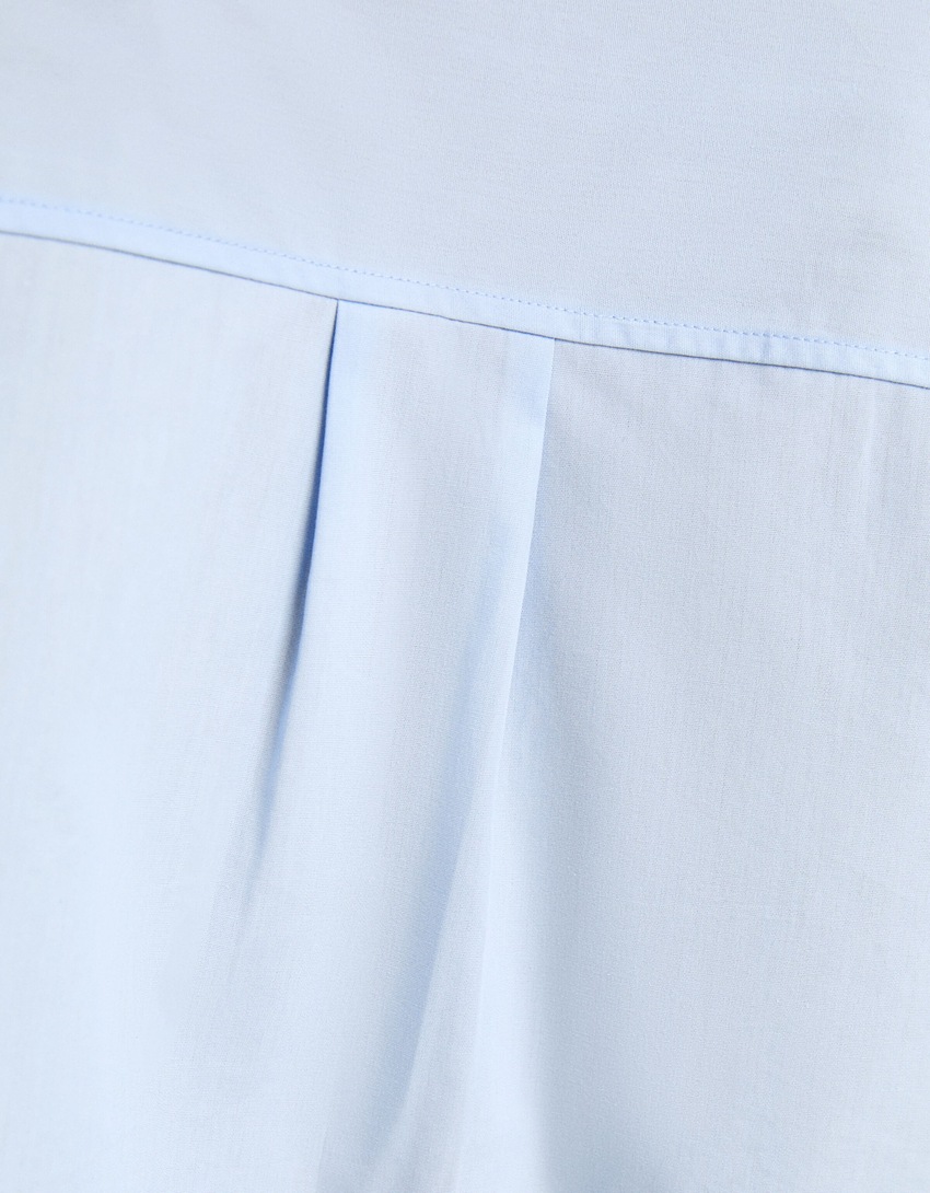 Camisa cropped de popeline de manga comprida com alças.
