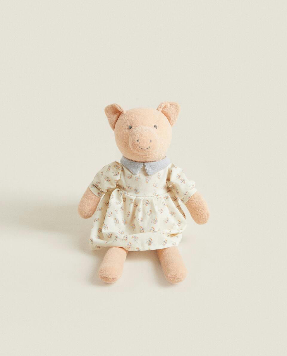 Porquinho de pelúcia infantil vestido