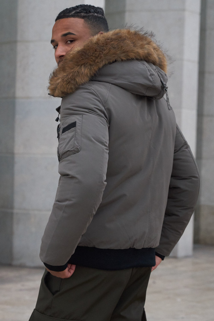 Parka bi-matière olive à capuche en fourrure