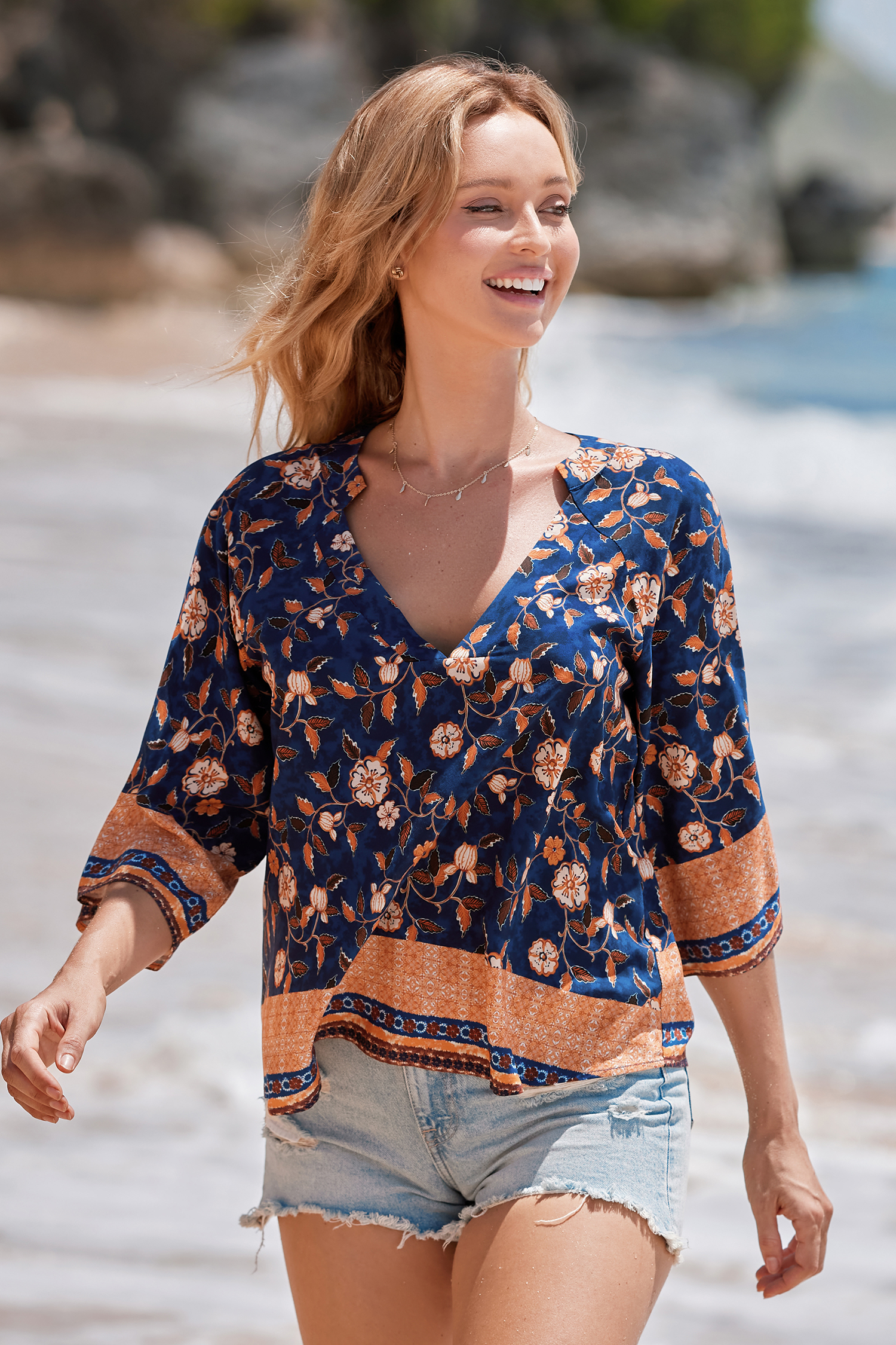Haut blouson à fleurs bleu et orange