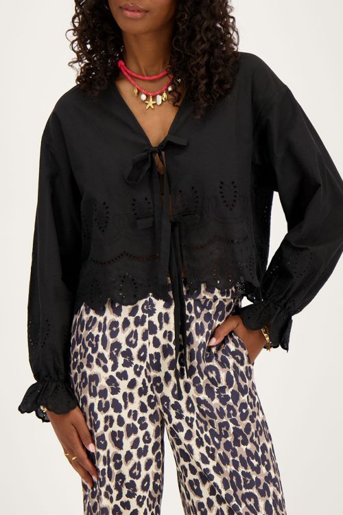Zwarte blouse met strikjes en broderie