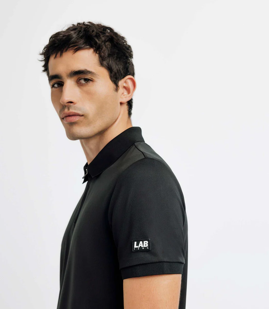 Polo col zippé avec patch noir