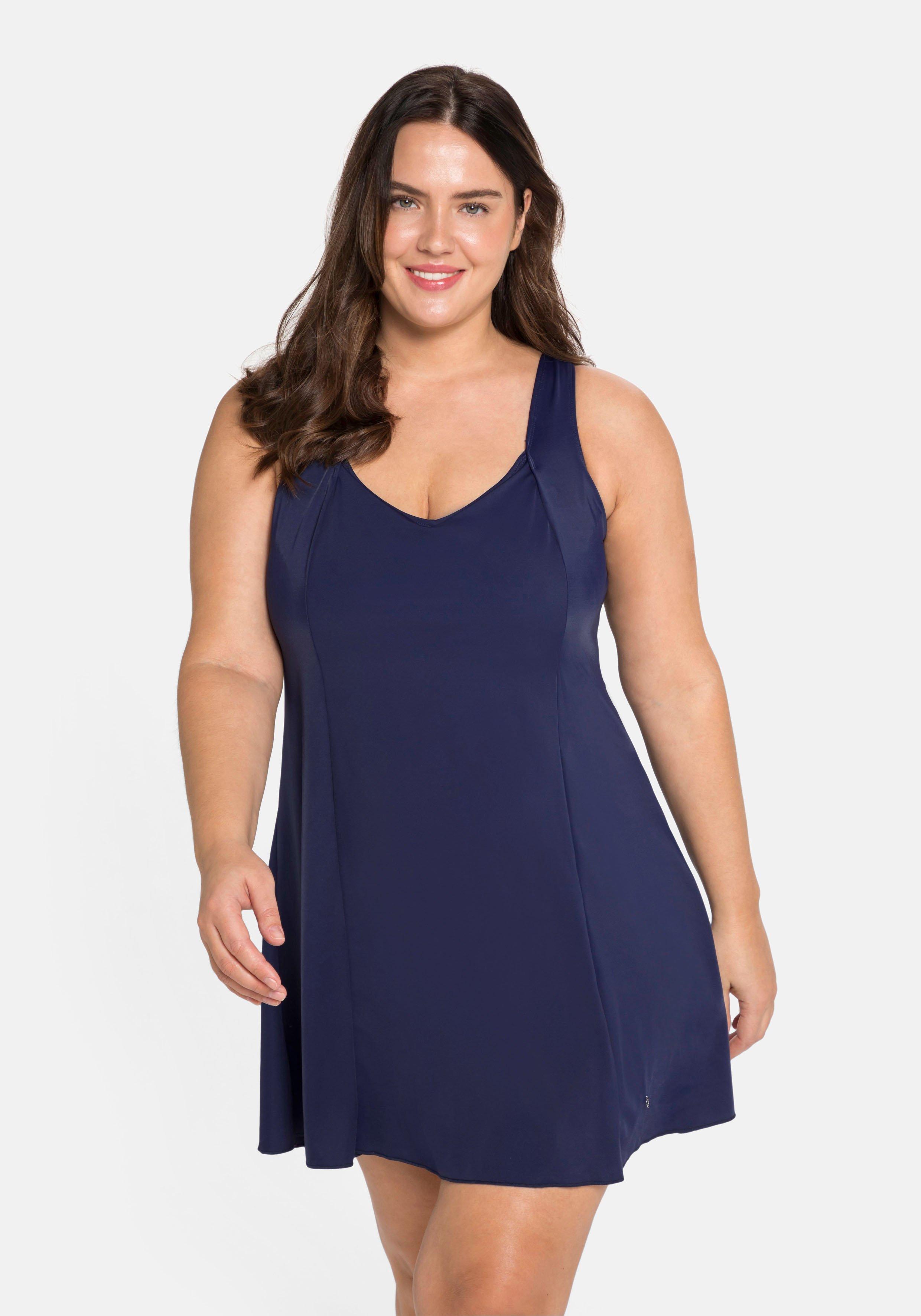 Badekleid mit V-Ausschnitt und integrierter Hose.