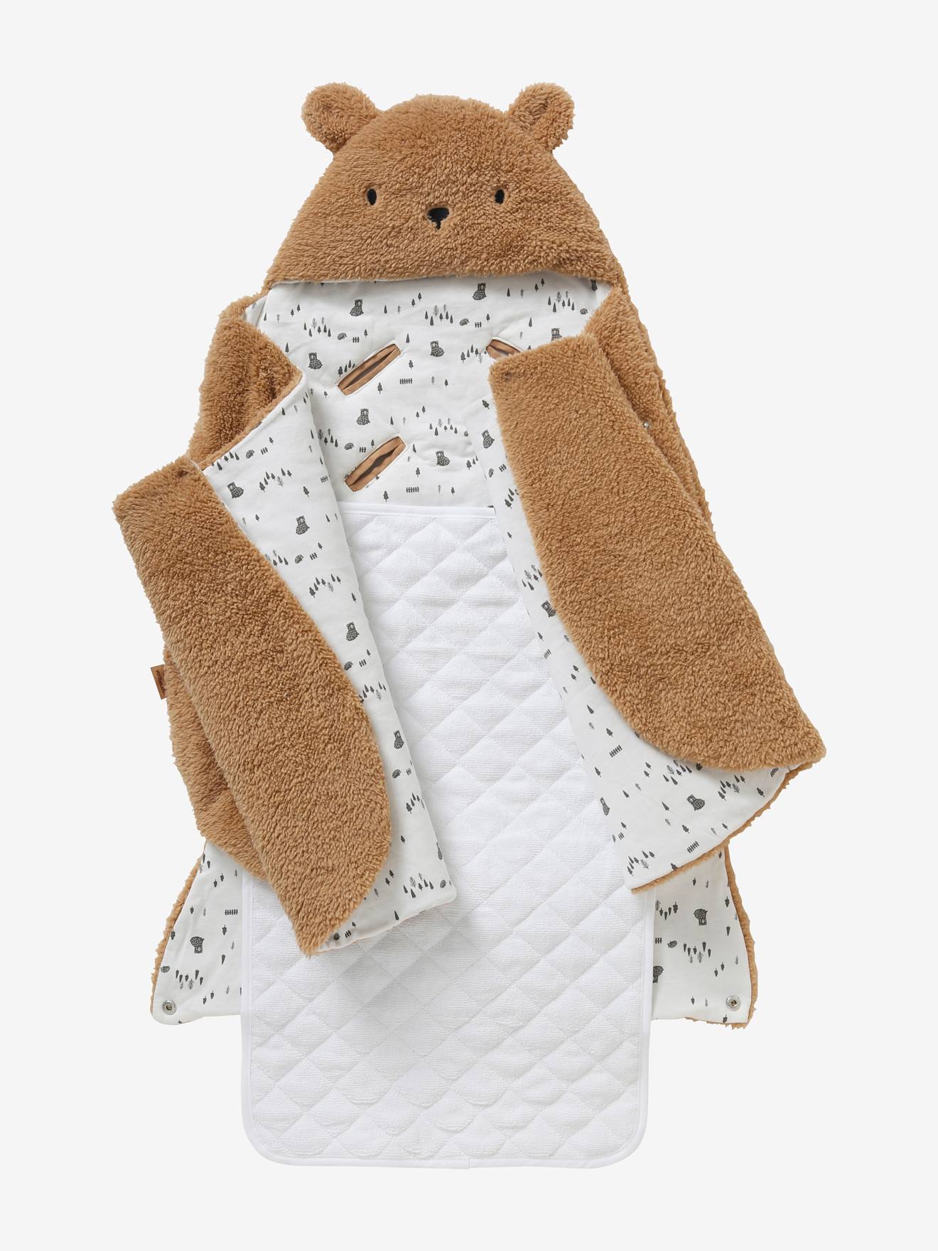 Saco transformável em brinquedo de pelúcia. Urso de pelúcia liso bege claro com estampas.