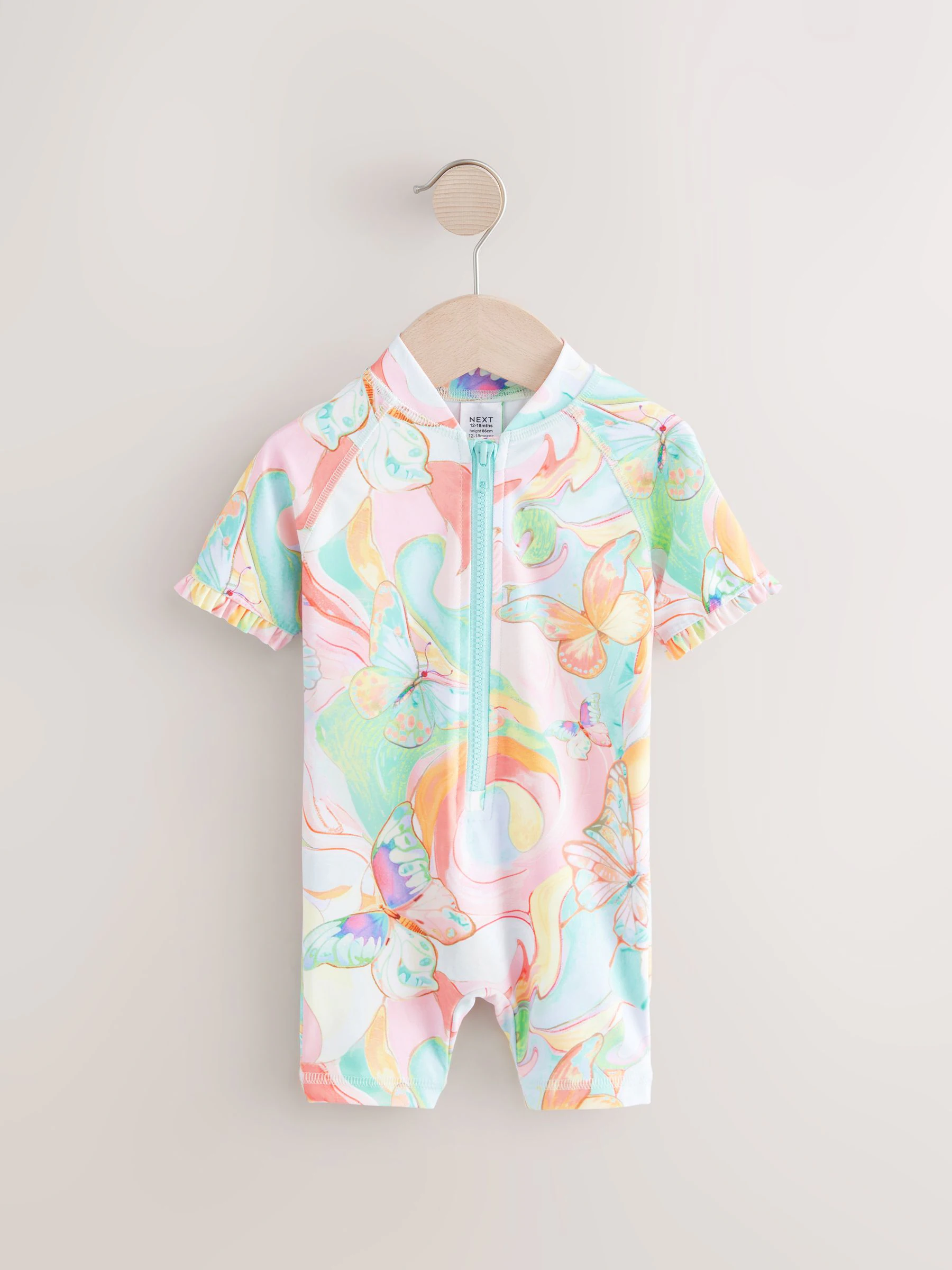 Pastelkleurig met vlinderprint - Zonbeschermend badpak met ruchemouwen (3mnd-10jr)