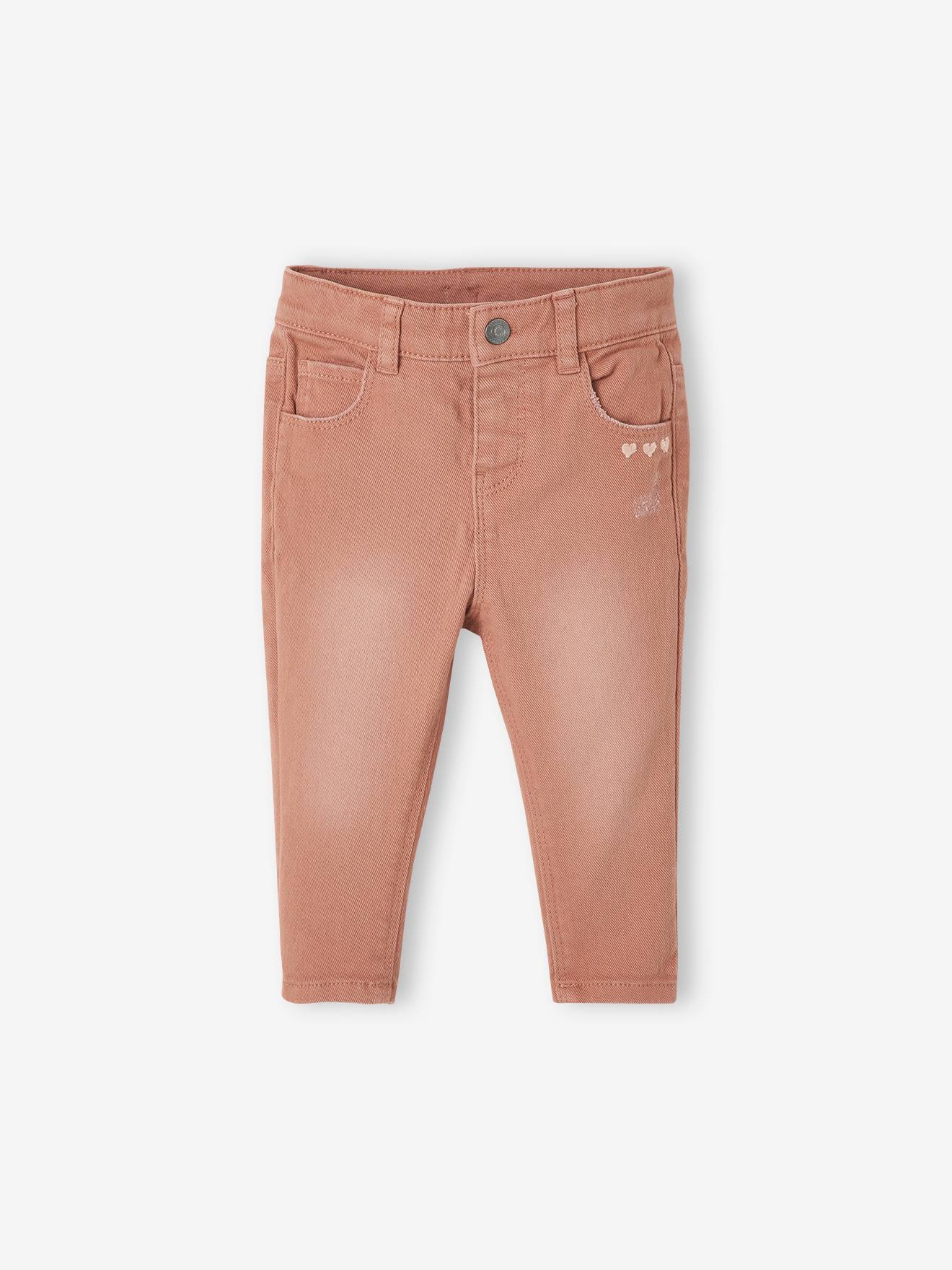 Calças de bebê slim fit em algodão stretch marrom médio, lisas com estampas.