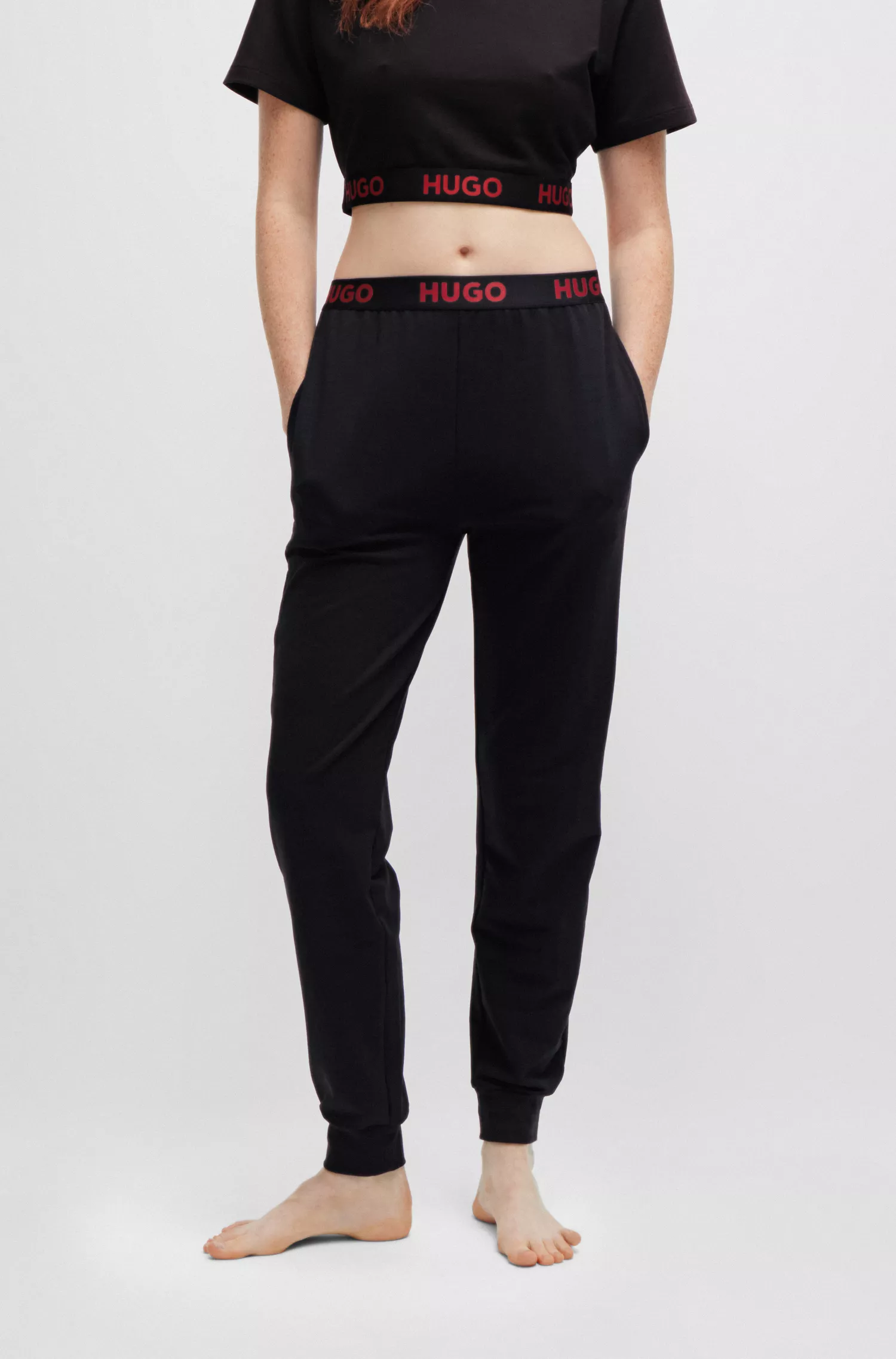 Calça de fato de treino HUGO vermelha com punhos e cós com logótipo.