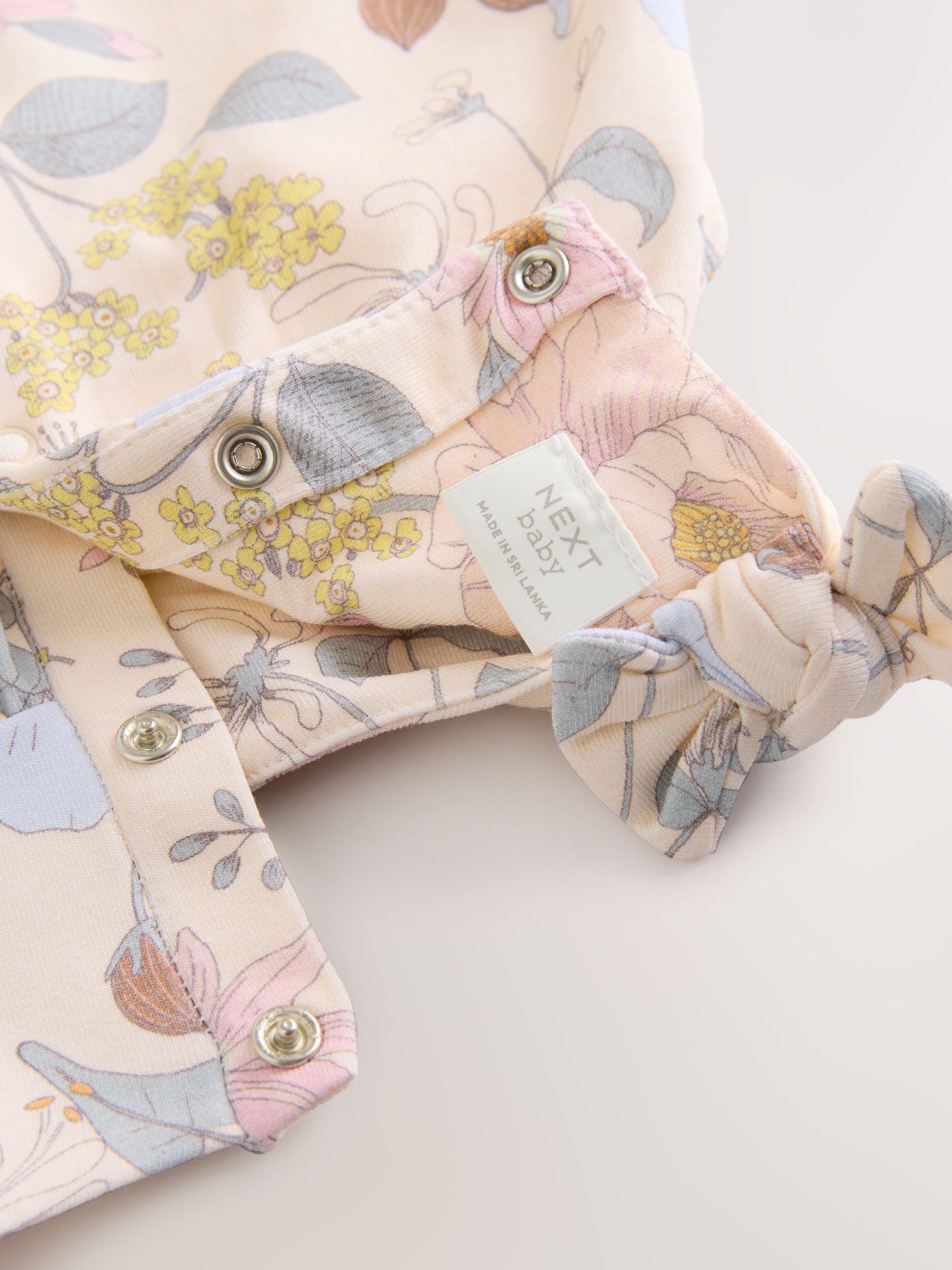 Roze bloemen - Babyromper met lange pijpen (0 mnd - 3 jr)