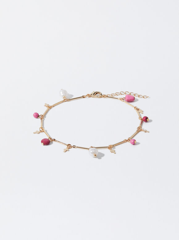 Pulseira de tornozelo multicolorida com pedra e pingentes.