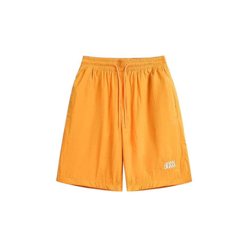 Hushgrain - Wijde shorts met hoge taille en letters