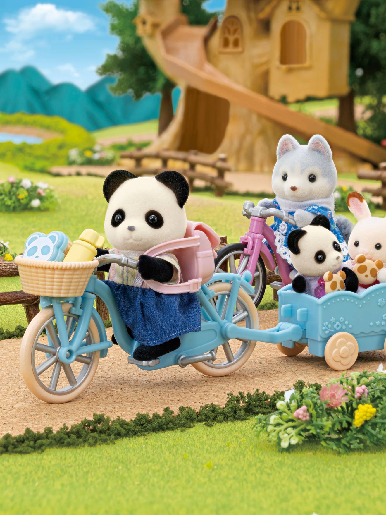 Menina panda, sua bicicleta e seu reboque