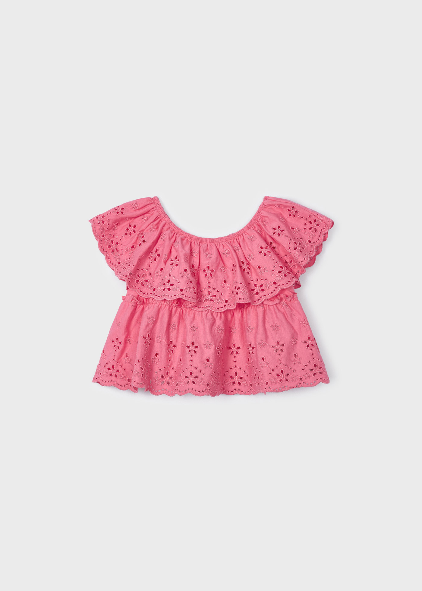 Blusa com motivos perfurados, feita de algodão sustentável, para meninas.