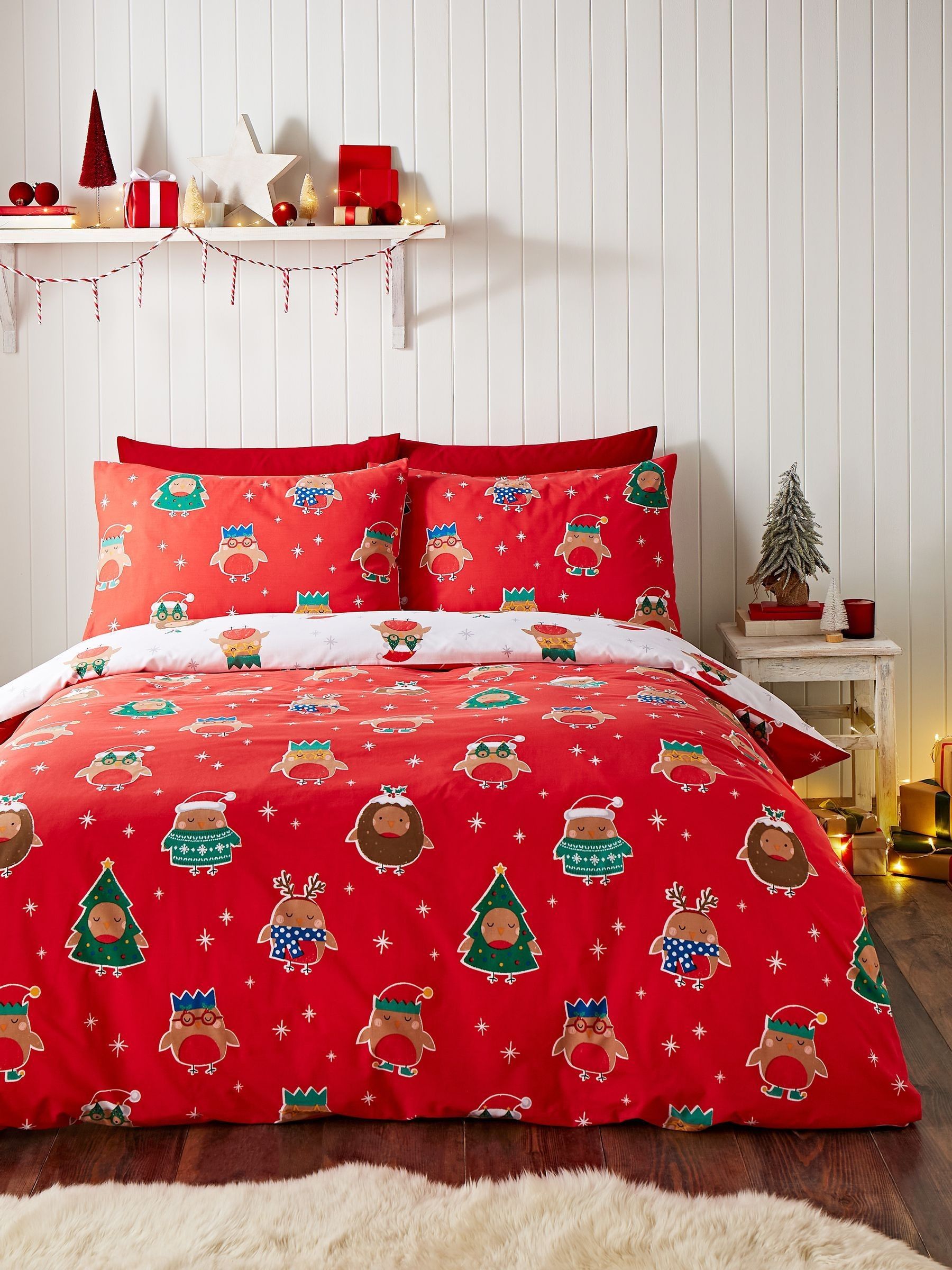 Catherine Lansfield omkeerbaar dekbedovertrekset met roodborstjes en kerstthema.