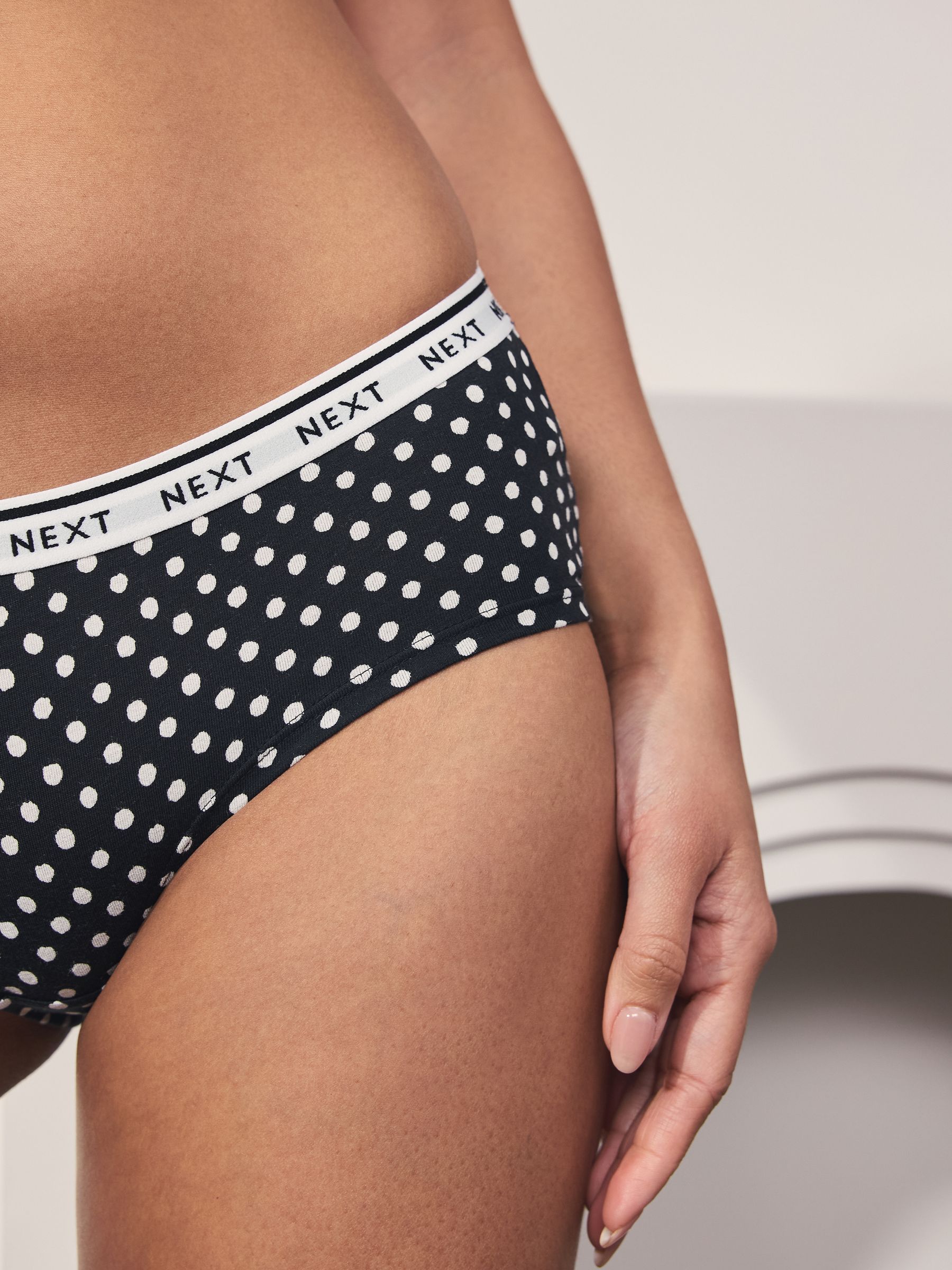 Zwart/wit met bloemenprint - 4 Katoenen slipjes met logotailleband