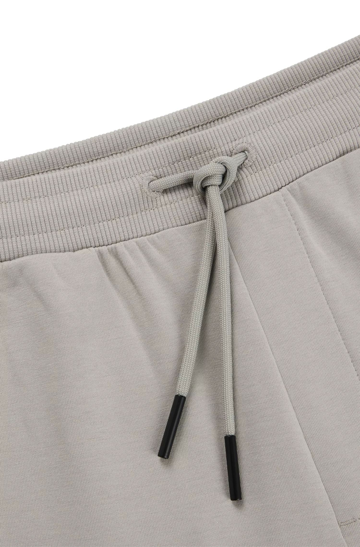 Calça de fato de treino BOSS em mistura de algodão verde com faixa com o logótipo.