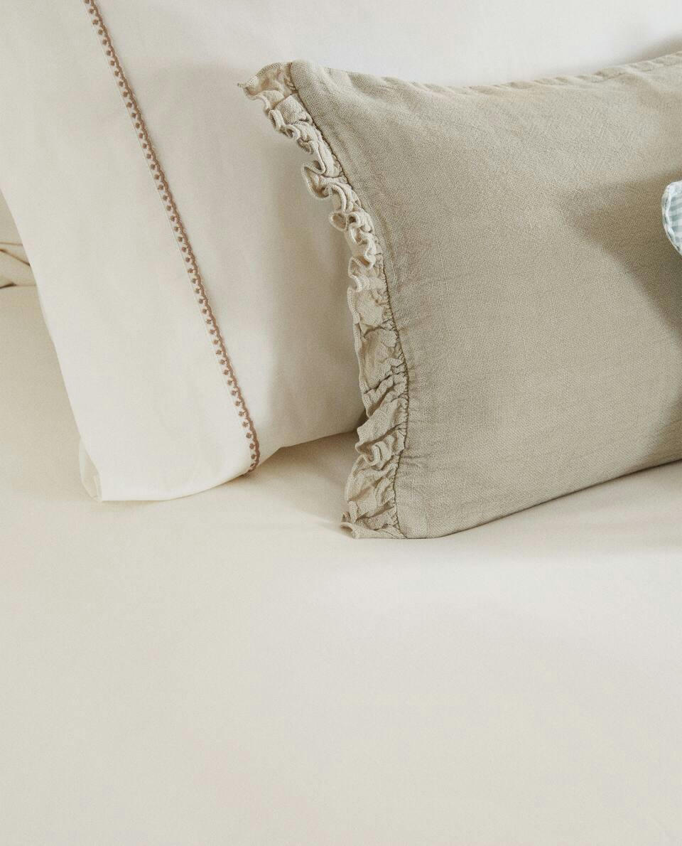 Lençol de baixo com costura decorativa