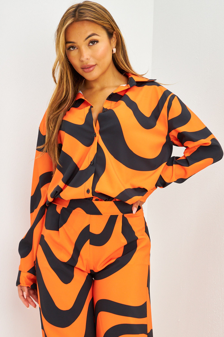 Ensemble fluide chemise + pantalon à lignes courbes orange