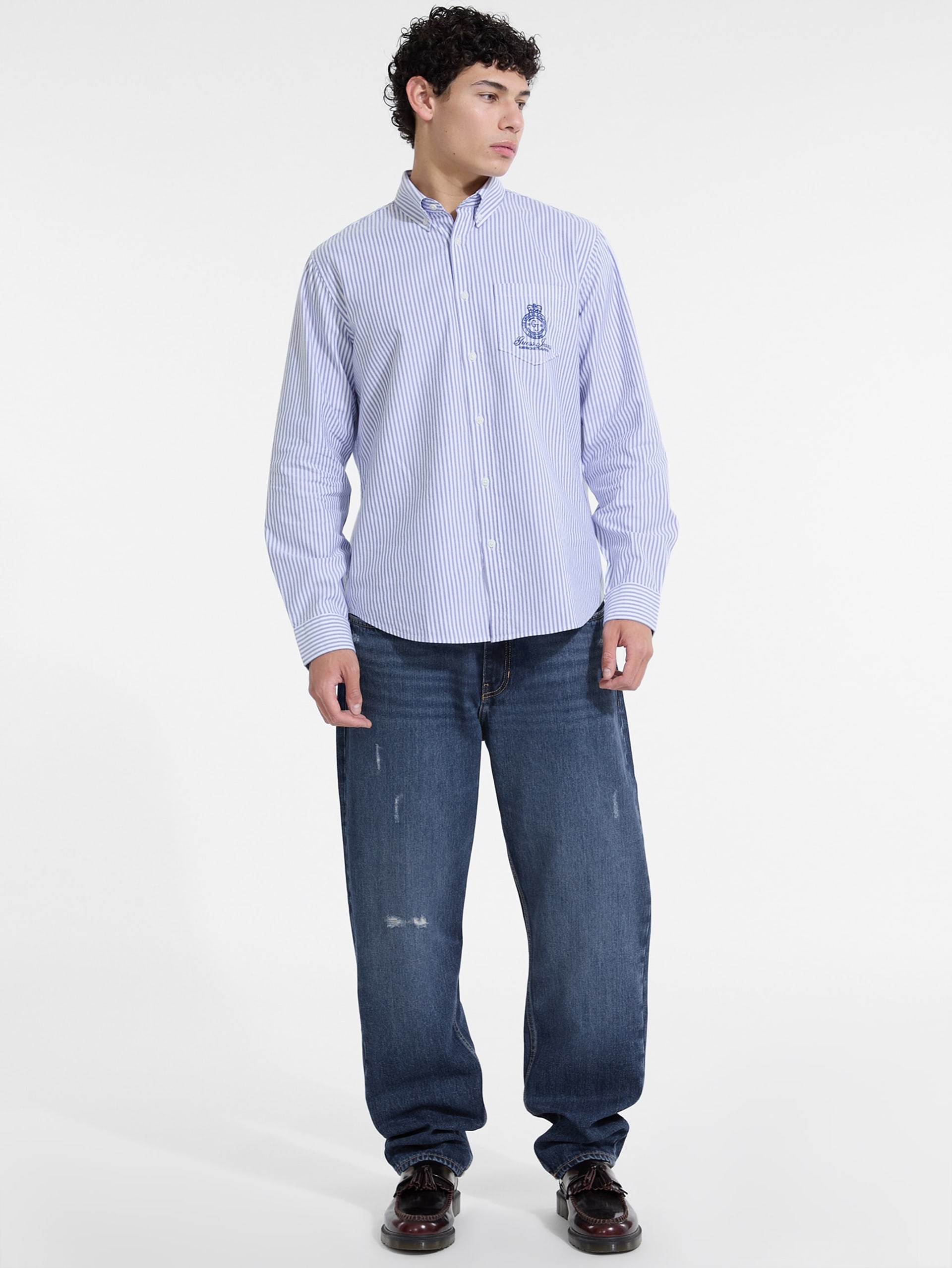 Camisa listrada de manga comprida com bolso