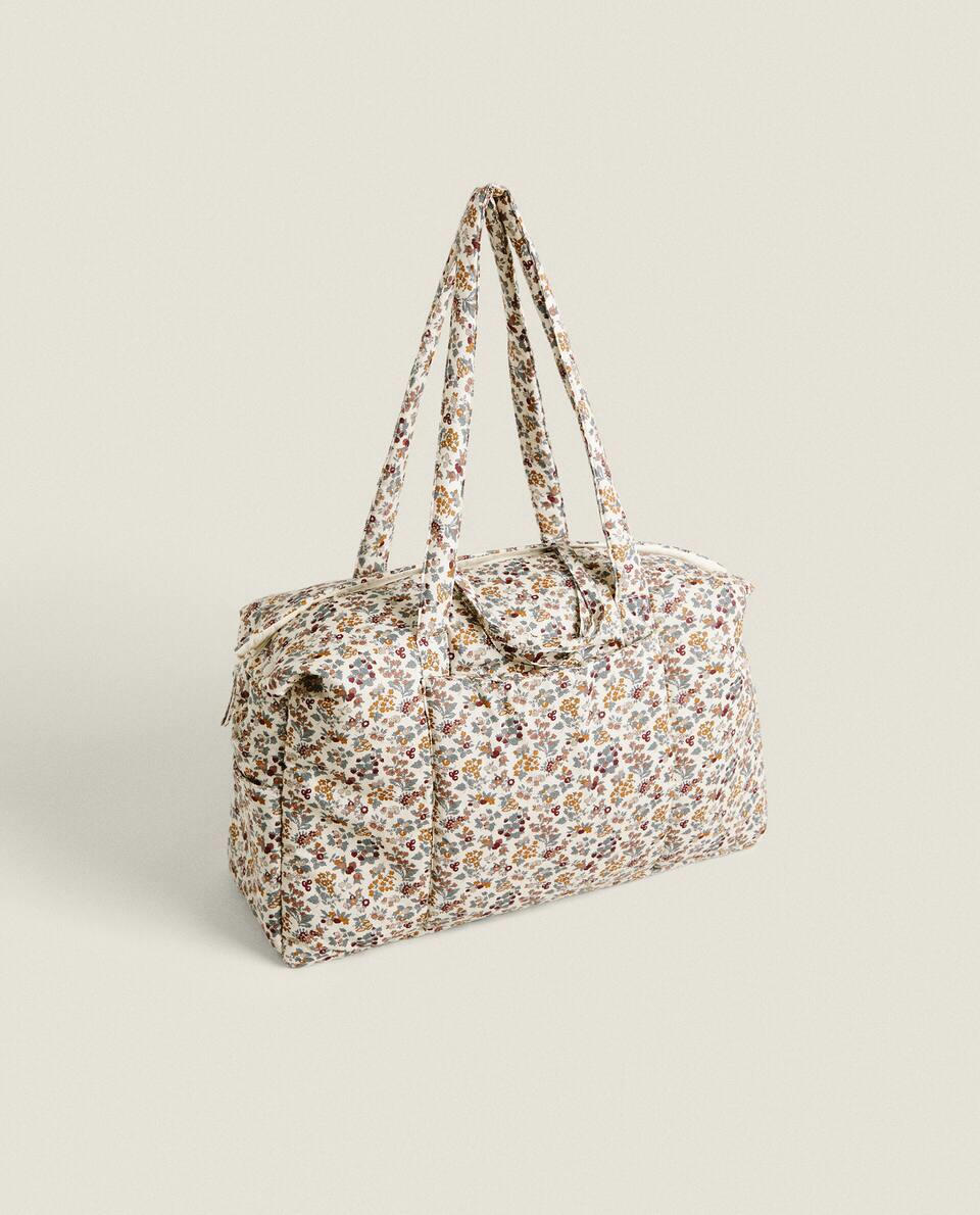 Bolsa de maternidade infantil em tecido com estampa floral