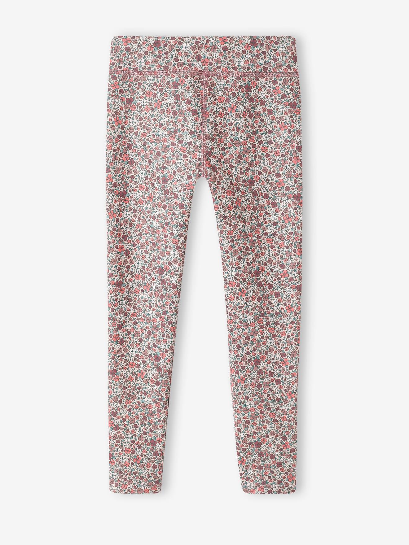 Leggings esportivas femininas em tecido técnico com estampa floral rosa.