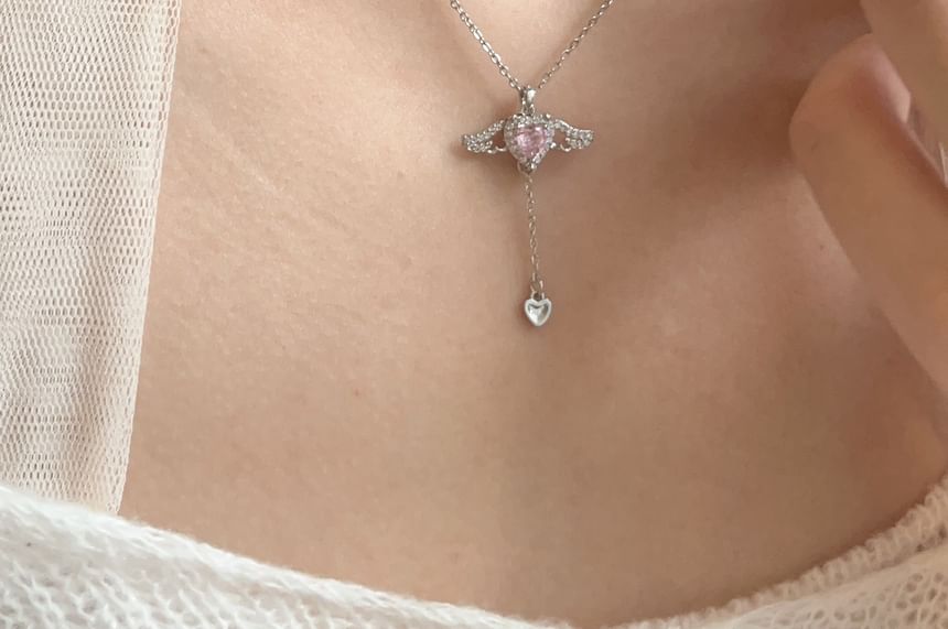 Sharkkira - Oorbel met strik en strasssteentjes / Ketting met harthanger