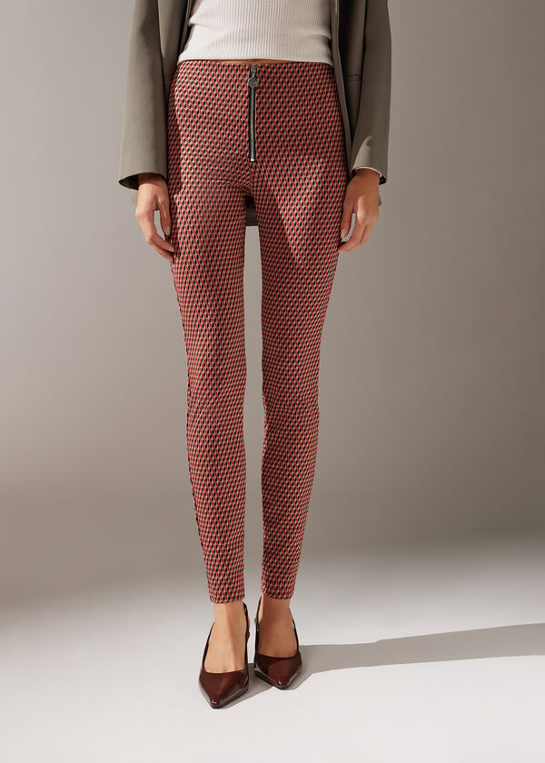 Calça legging skinny de malha elástica com zíper.
