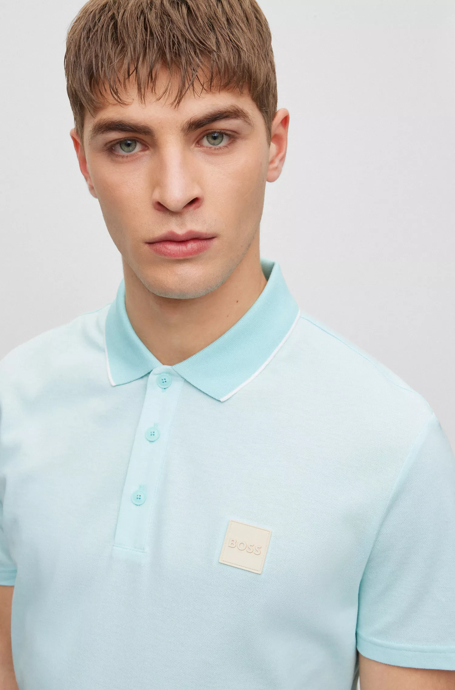 Camisa polo BOSS laranja em algodão Oxford com emblema da marca.