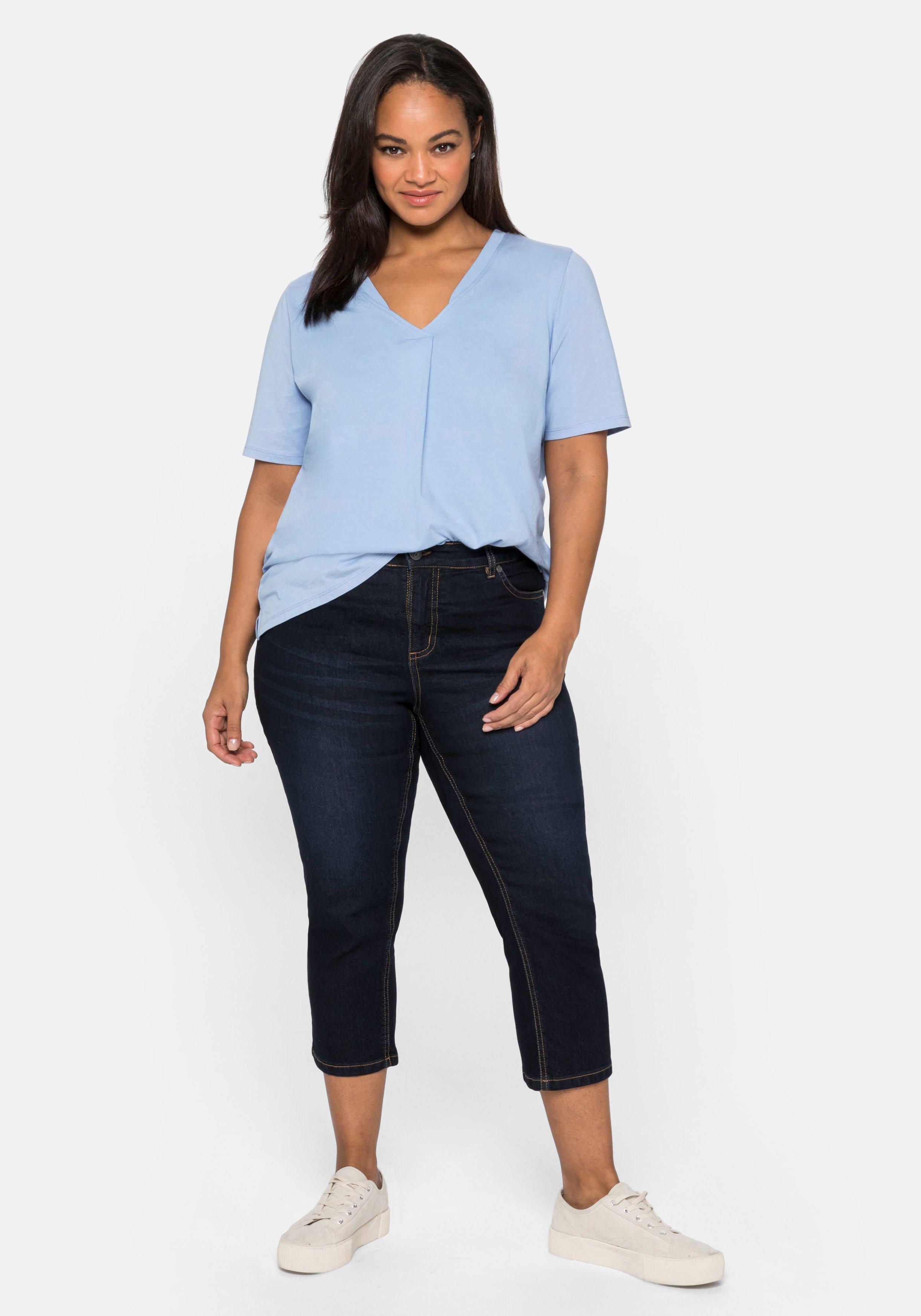 Caprijeans mit Kontrastnähten und Catfaces
