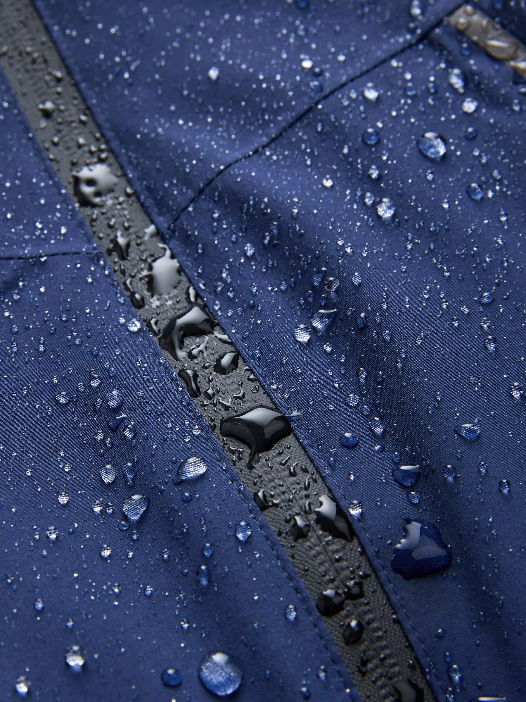Donkerblauw - Waterdichte jas met fleece voering en capuchon (3-17jr)