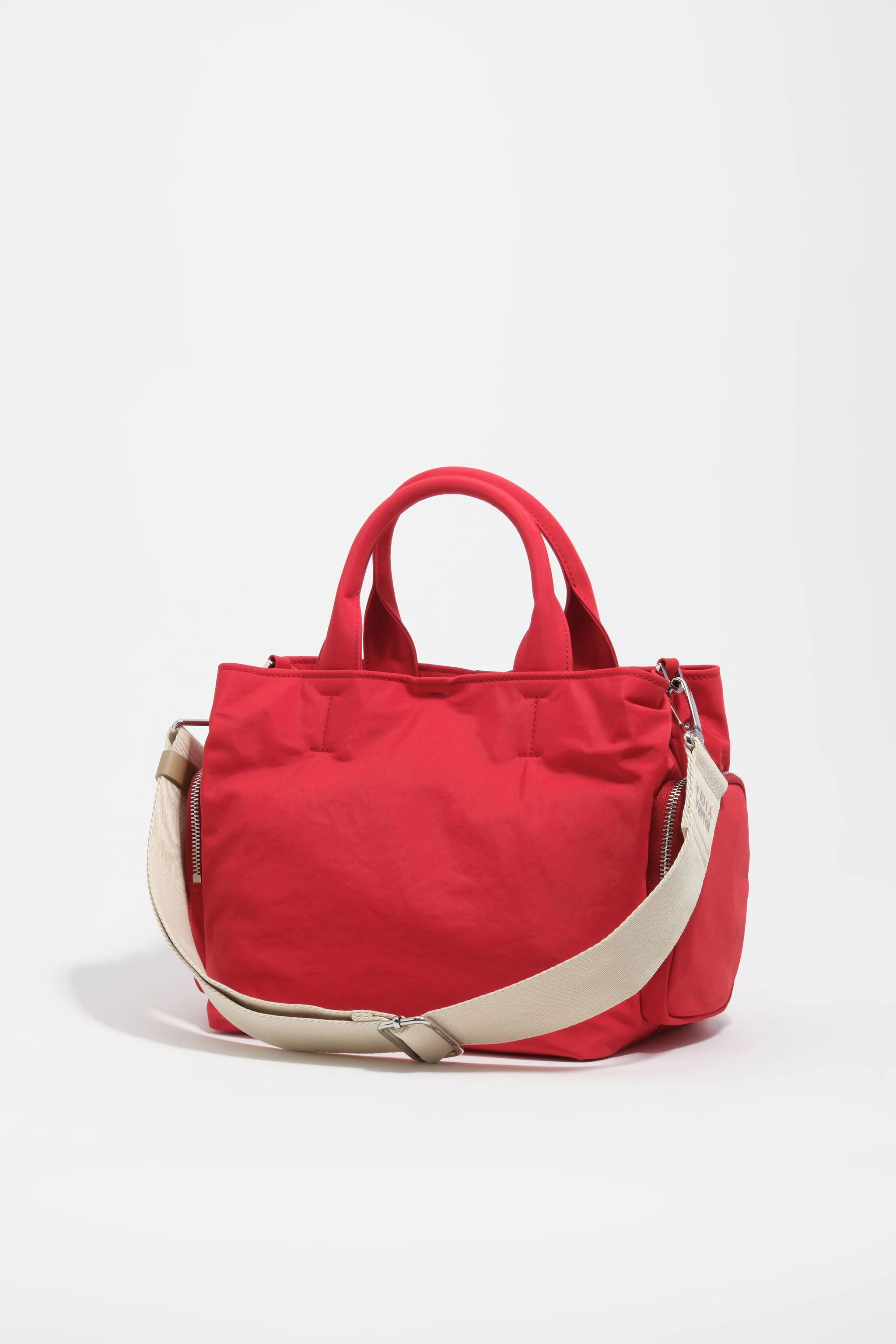 Bolsa transversal grande de nylon vermelha com bolsos.