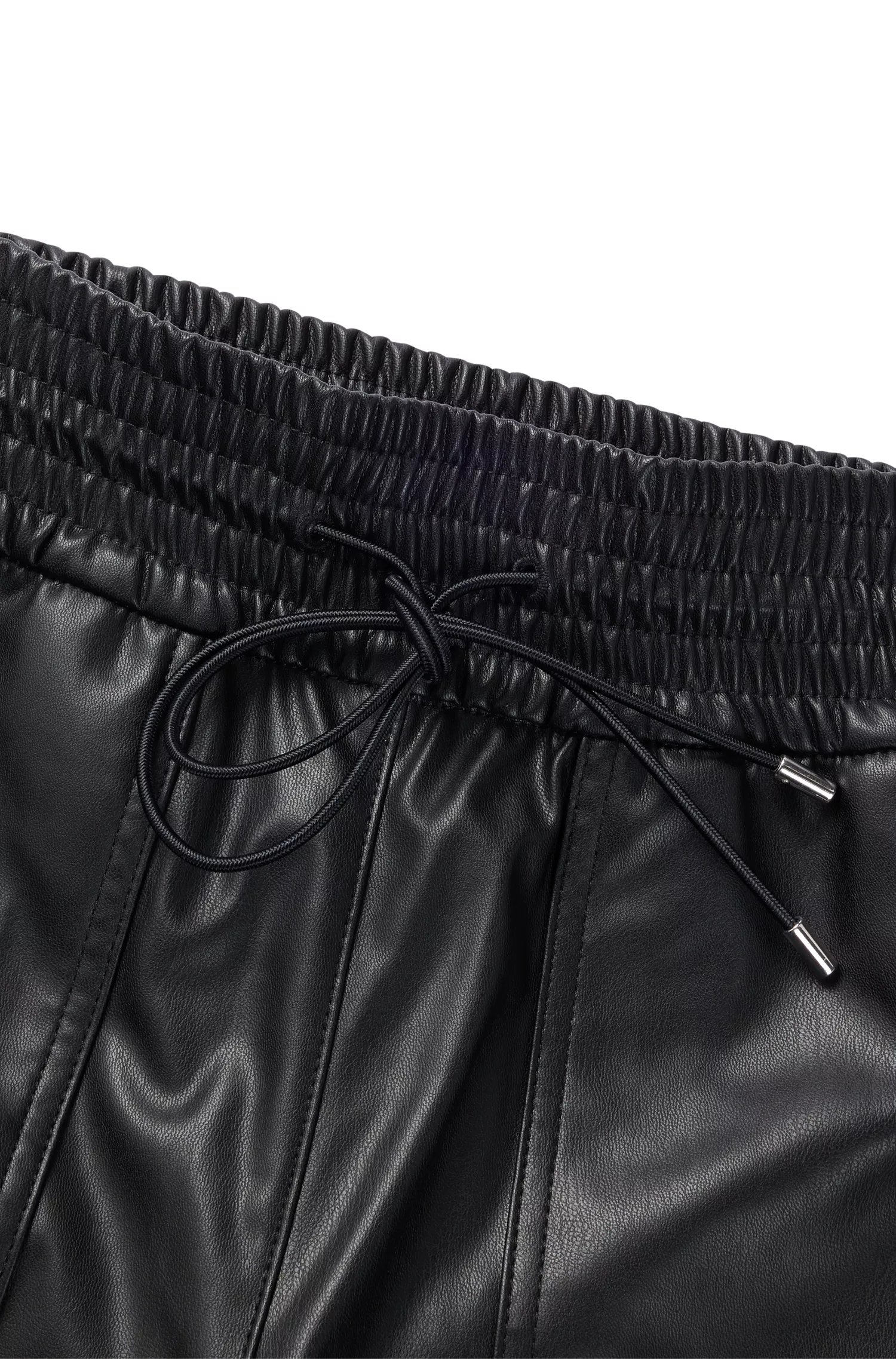 Calça BOSS laranja, corte relaxado, em tecido revestido, com cintura ajustável por cordão.