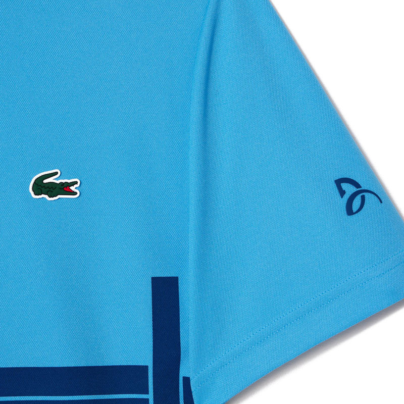Polo tennis Lacoste Fan Djokovic US Open bleu