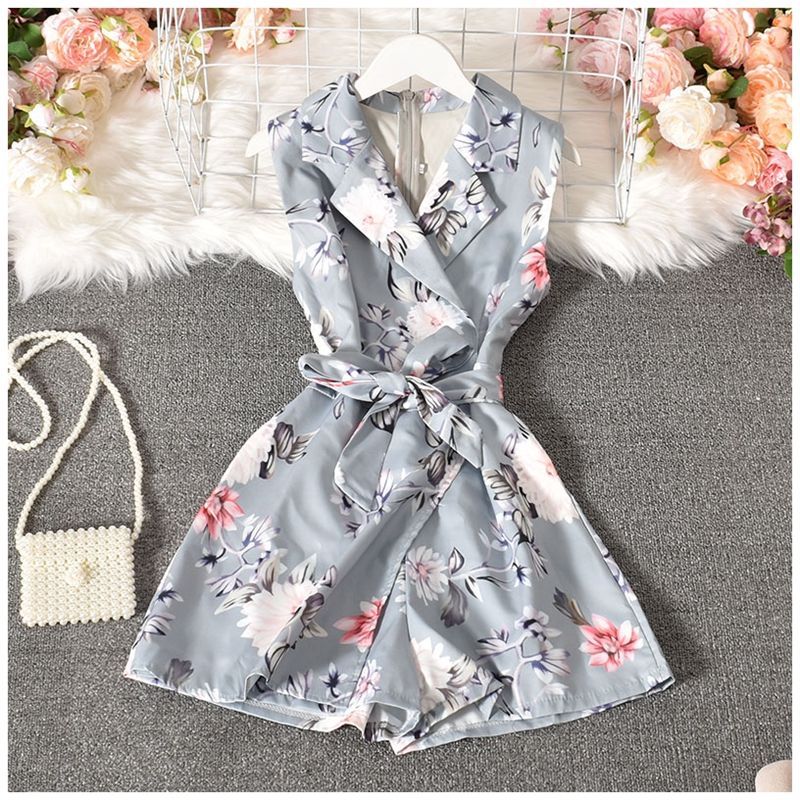 Dudu - Mouwloze romper met bloemenprint en strikceintuur