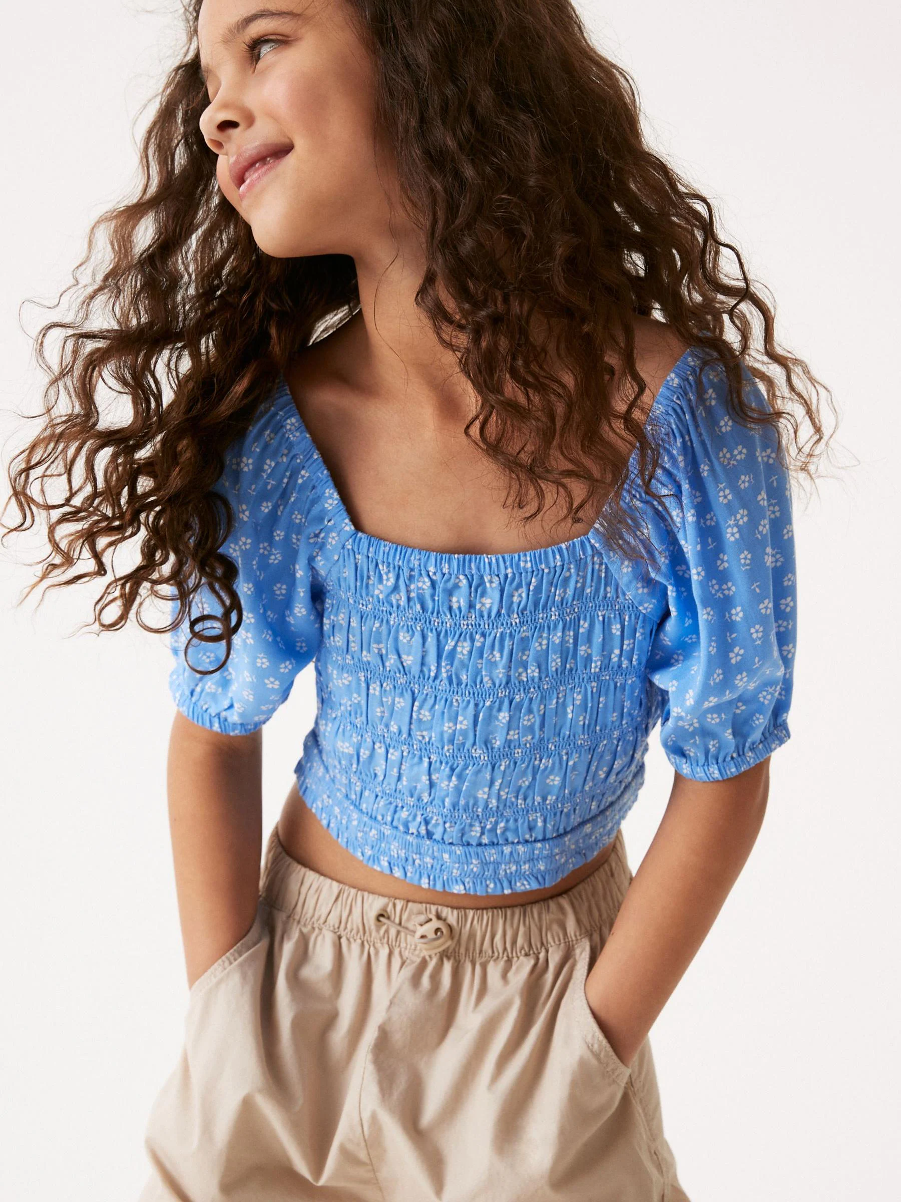 Blauw gebloemd - Gesmokte blouse (3-16jr)
