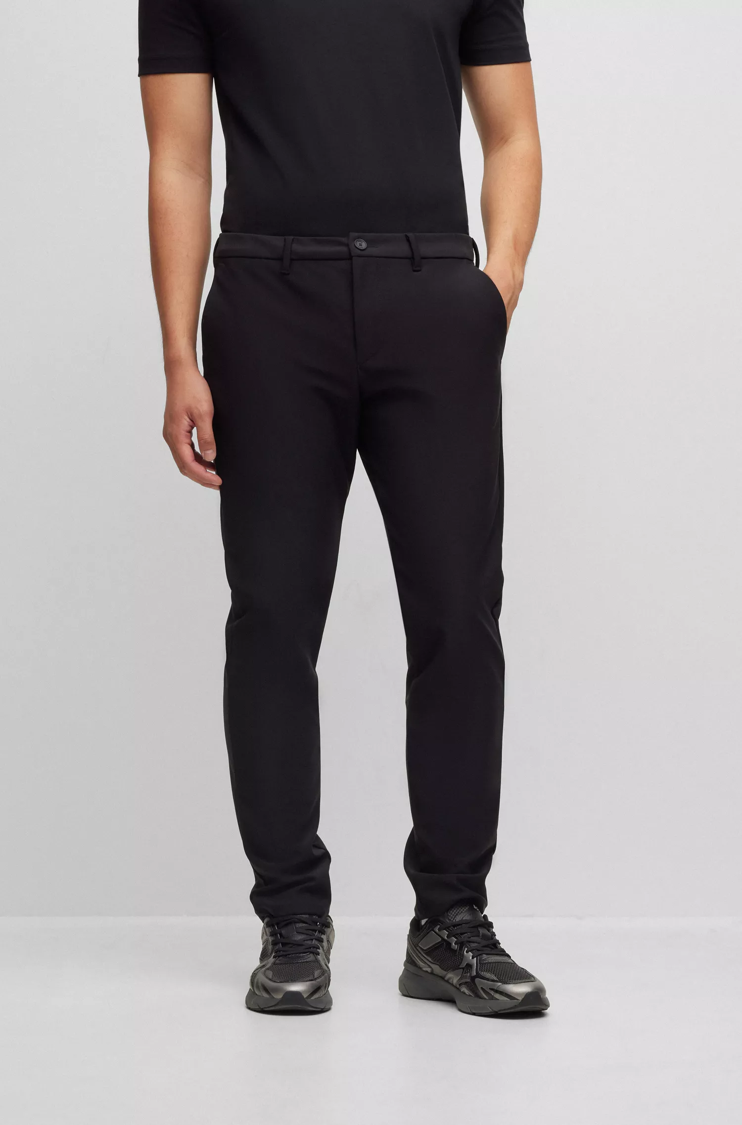 Calça BOSS verde-slim em tecido softshell impermeável.