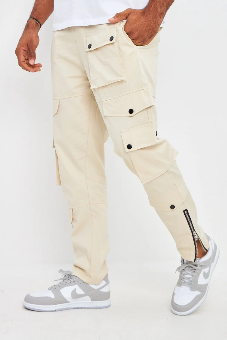 Pantalon beige cargo zippé aux chevilles
