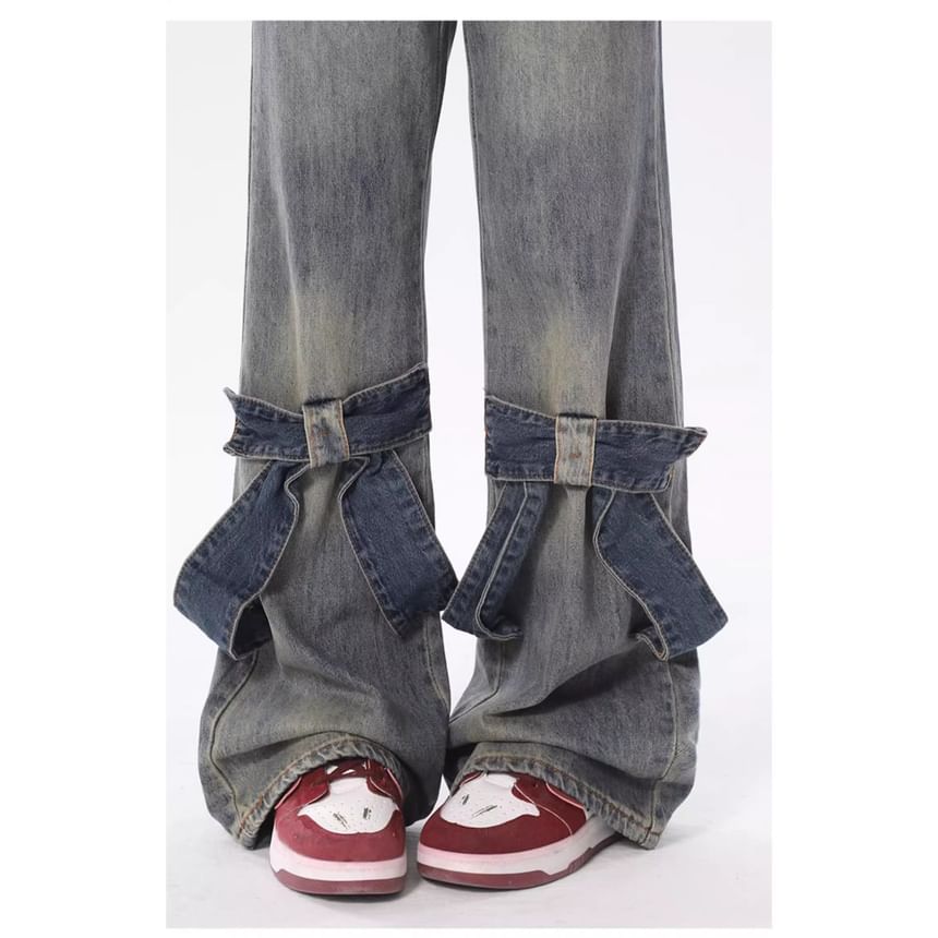 Jerolenea - Bootcut jeans met lage taille en strikaccent