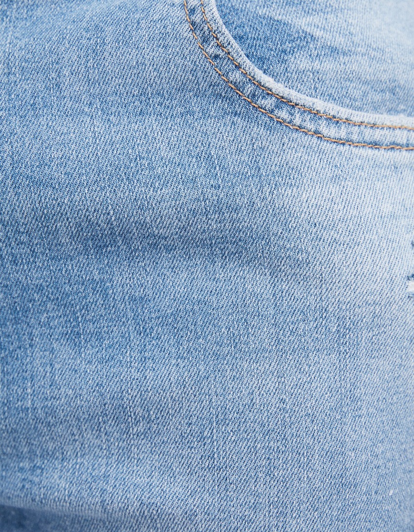 Calça jeans skinny rasgada