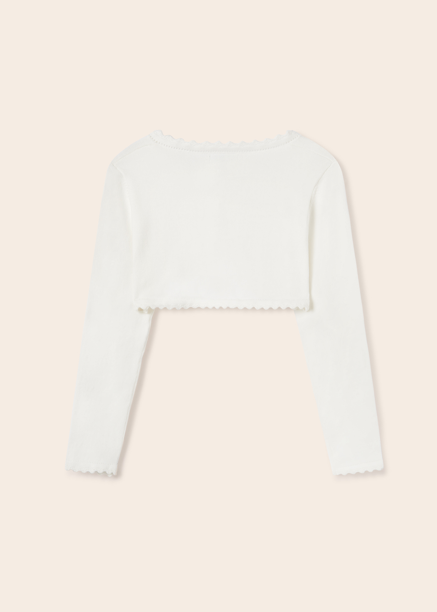 Casaquinho estilo bolero feito com algodão sustentável para meninas