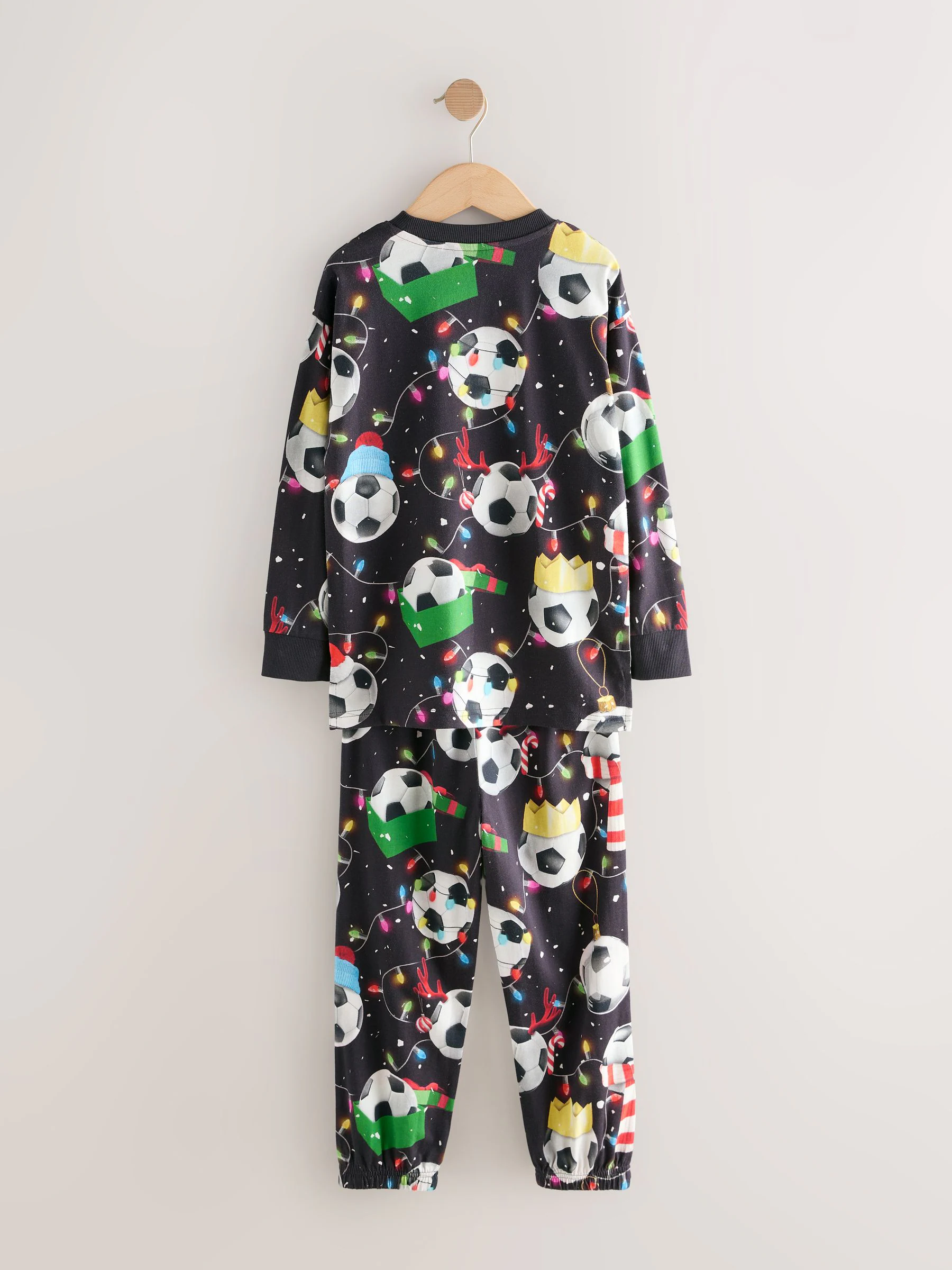 Zwart/wit/rood/groen voetbal - Enkele kerstpyjama (4-16jr)