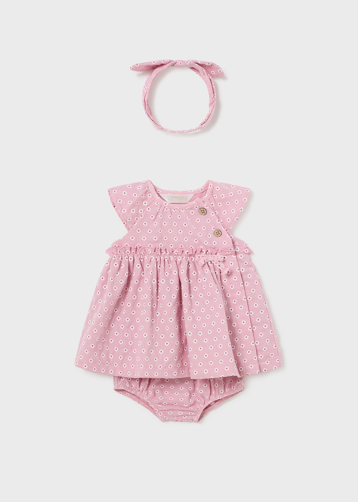 Vestido Jade para recém-nascido da Better Cotton com capa de fralda e faixa de cabelo.