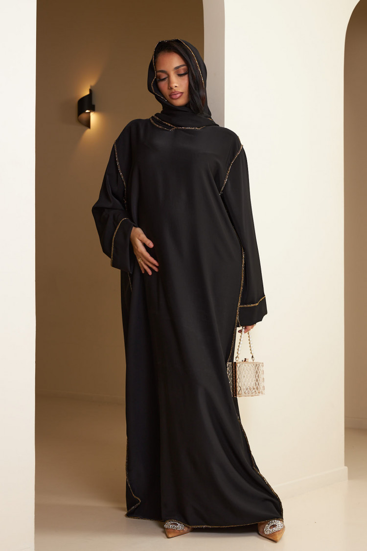 Abaya noire avec voile intégré à couture dorée