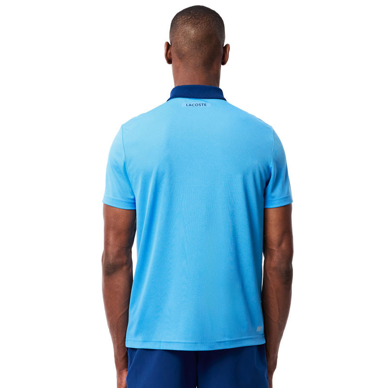 Polo tennis Lacoste Fan Djokovic US Open bleu