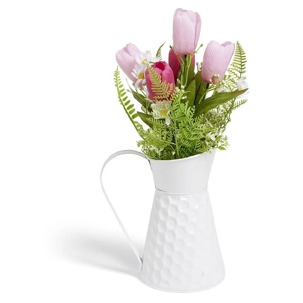 Fleus roses artificielles dans pot carafe blanc