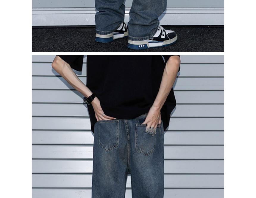 Trimecca - Hoge taille jeans met wijde pijpen en versleten look