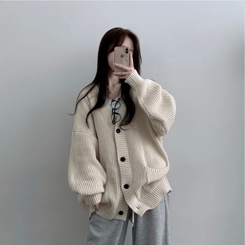 Coris - Oversized vest met pofmouwen, V-hals en effen zakdetail