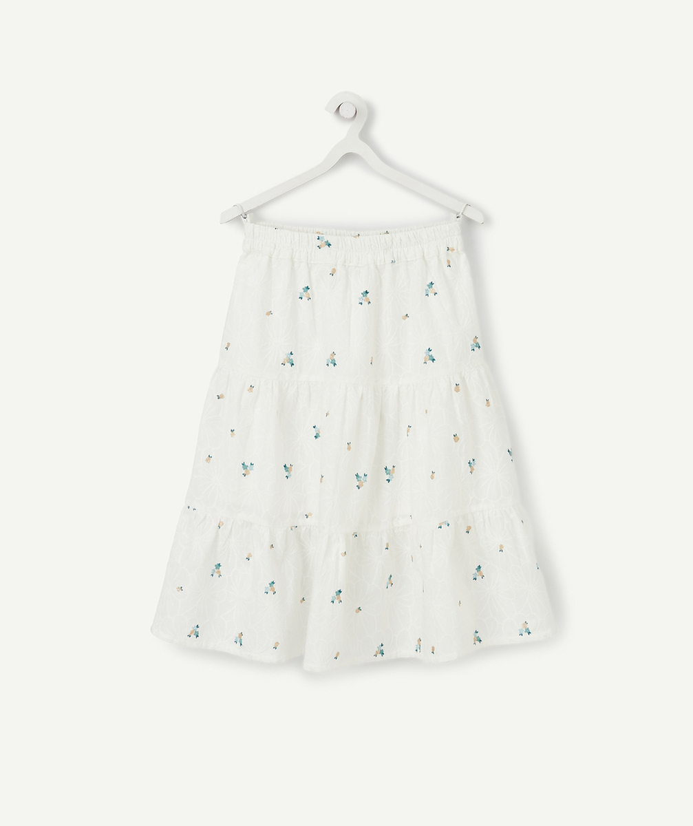 LA JUPE LONGUE BLANCHE EN COTON AVEC FLEURS ET DÉTAILS COULEUR DORÉE