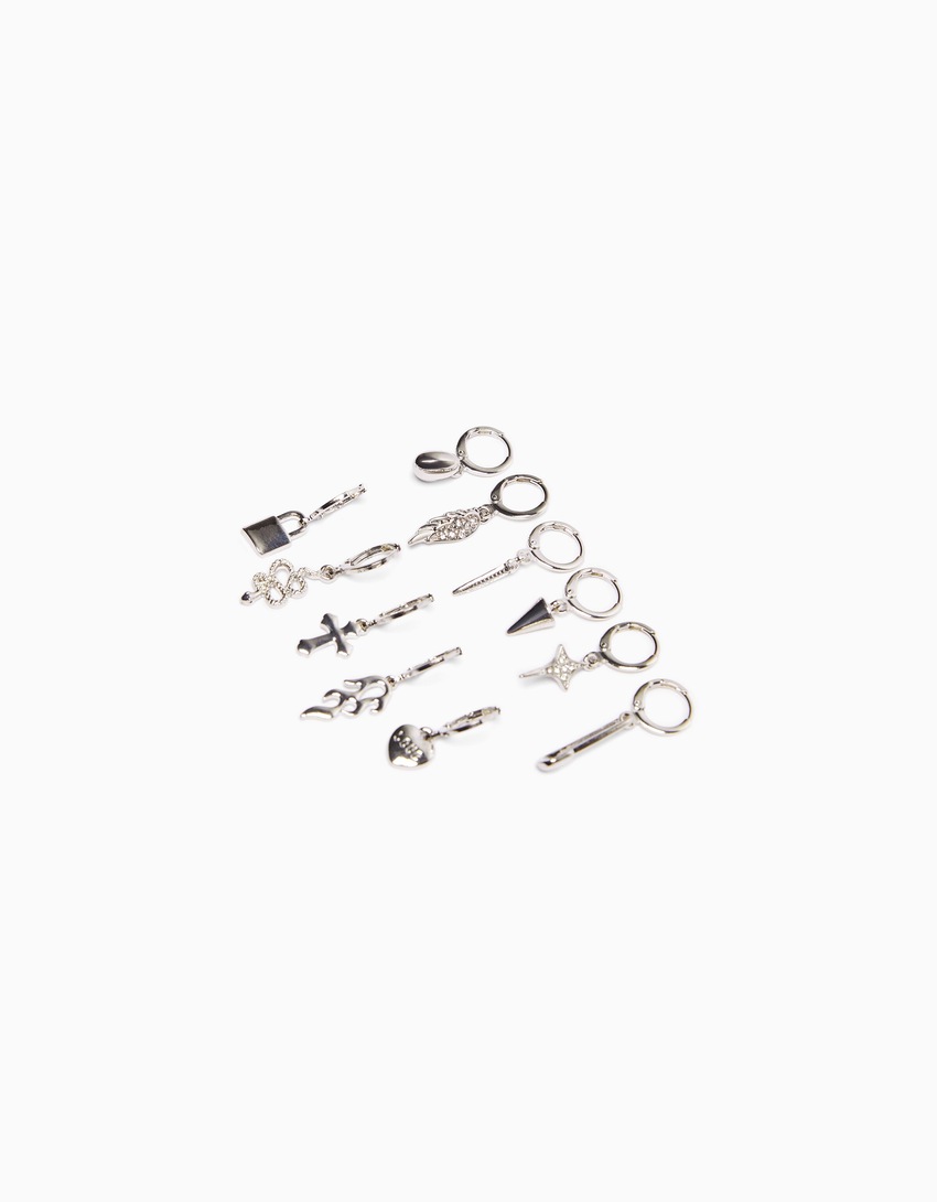 Conjunto de 11 brincos de pressão com detalhes de cobra, cruz e espinhos.