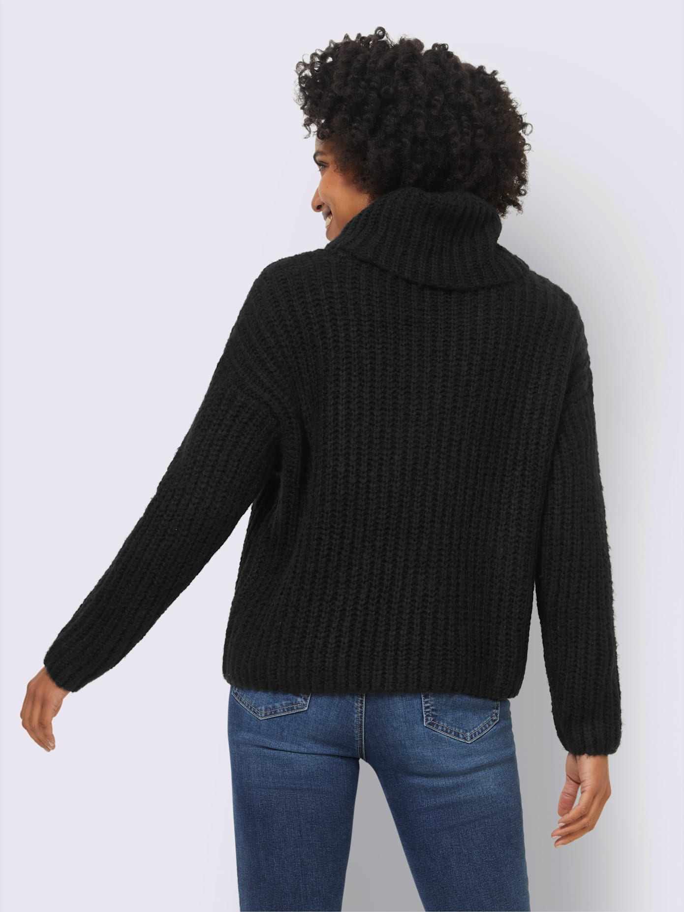 Pull grand col roulé
