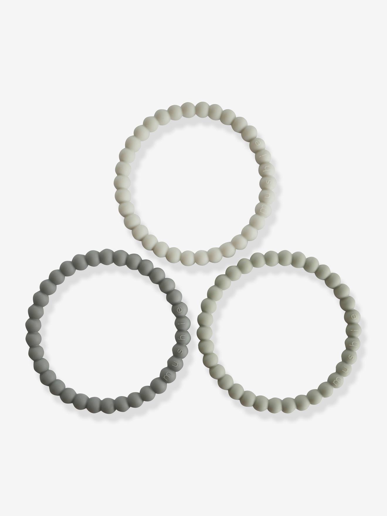 Lote com 3 pulseiras de dentição com contas.